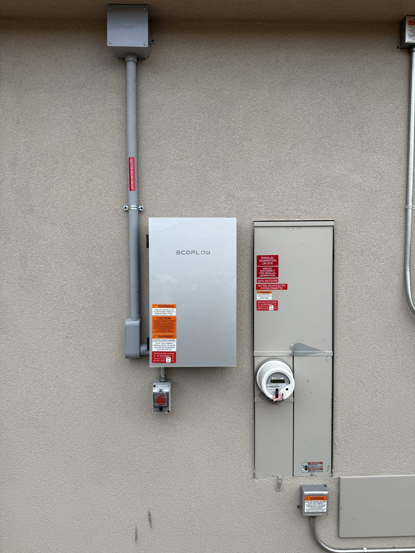 EcoFlow DPU inverter with electrical panel meter and disconnect mounted on exterior stucco wall